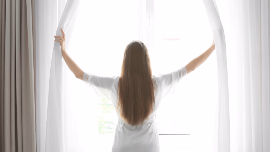 emotional awareness restores choice during personal change - woman at window morning light